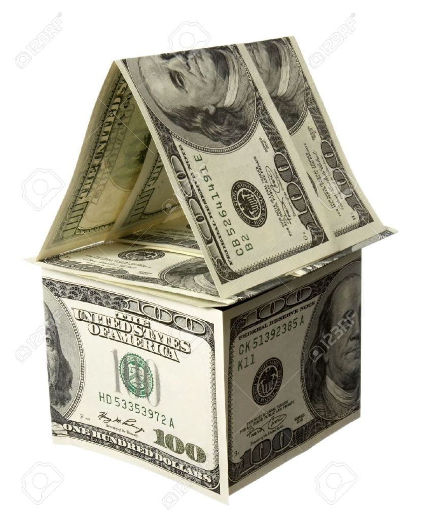 4719913-close-up-of-miniature-house-built-of-paper-currency-on-white-background-Stock-Photo